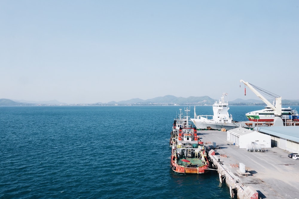 white ship on calm water at daytime