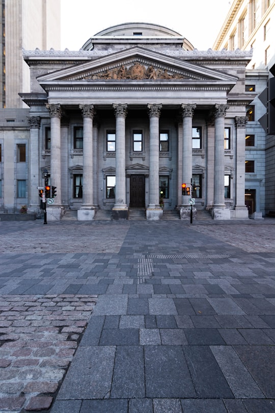 gray concrete building during daytime in Notre-Dame Basilica of Montreal Canada