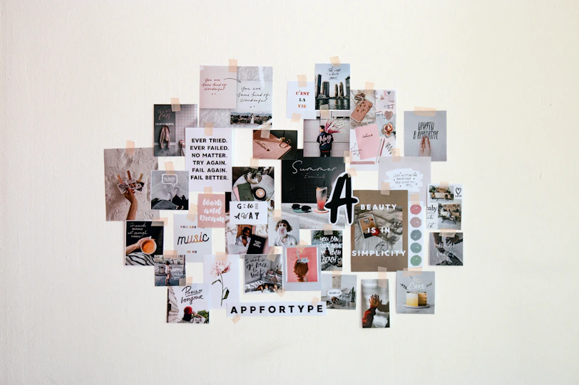 a collage of pictures and words on a white wall
