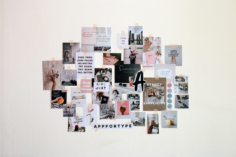 a collage of pictures and words on a white wall