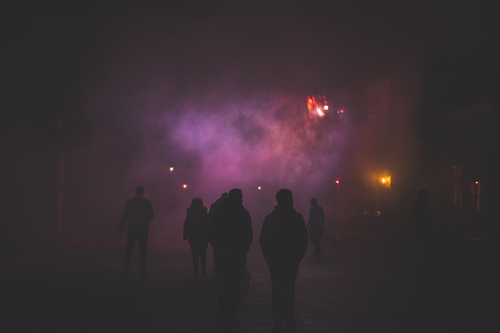 silhouette of people at night
