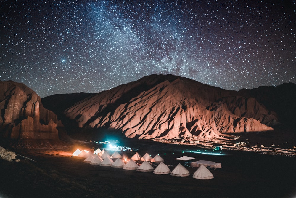tents near mountain during night time
