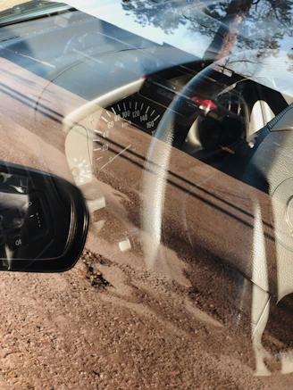 Shiny car dashboard reflecting sunlight, enhanced by dashboard shiner.