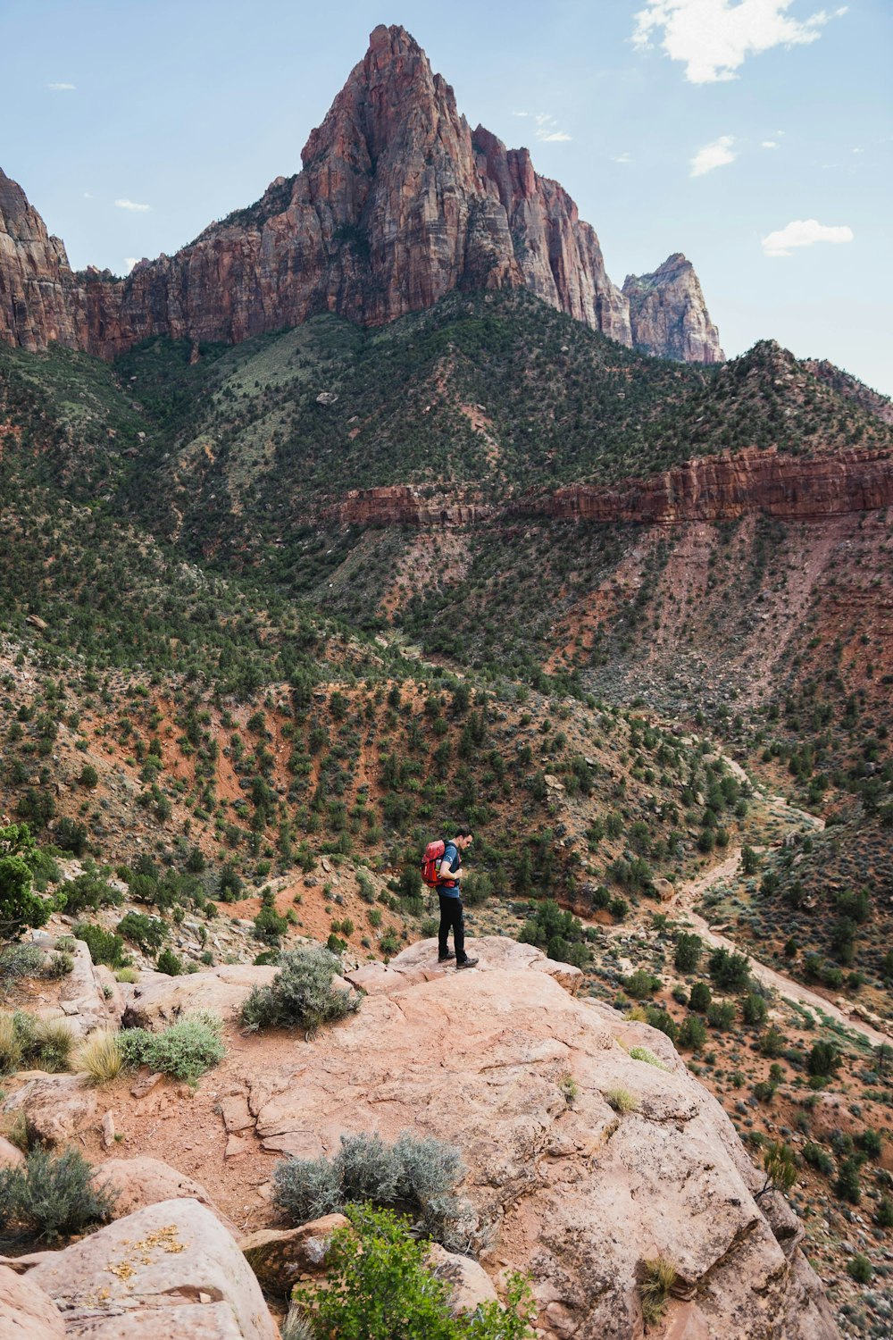 man standing on rock formation