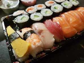 An assortment of colorful onigiri varieties arranged neatly on a serving tray