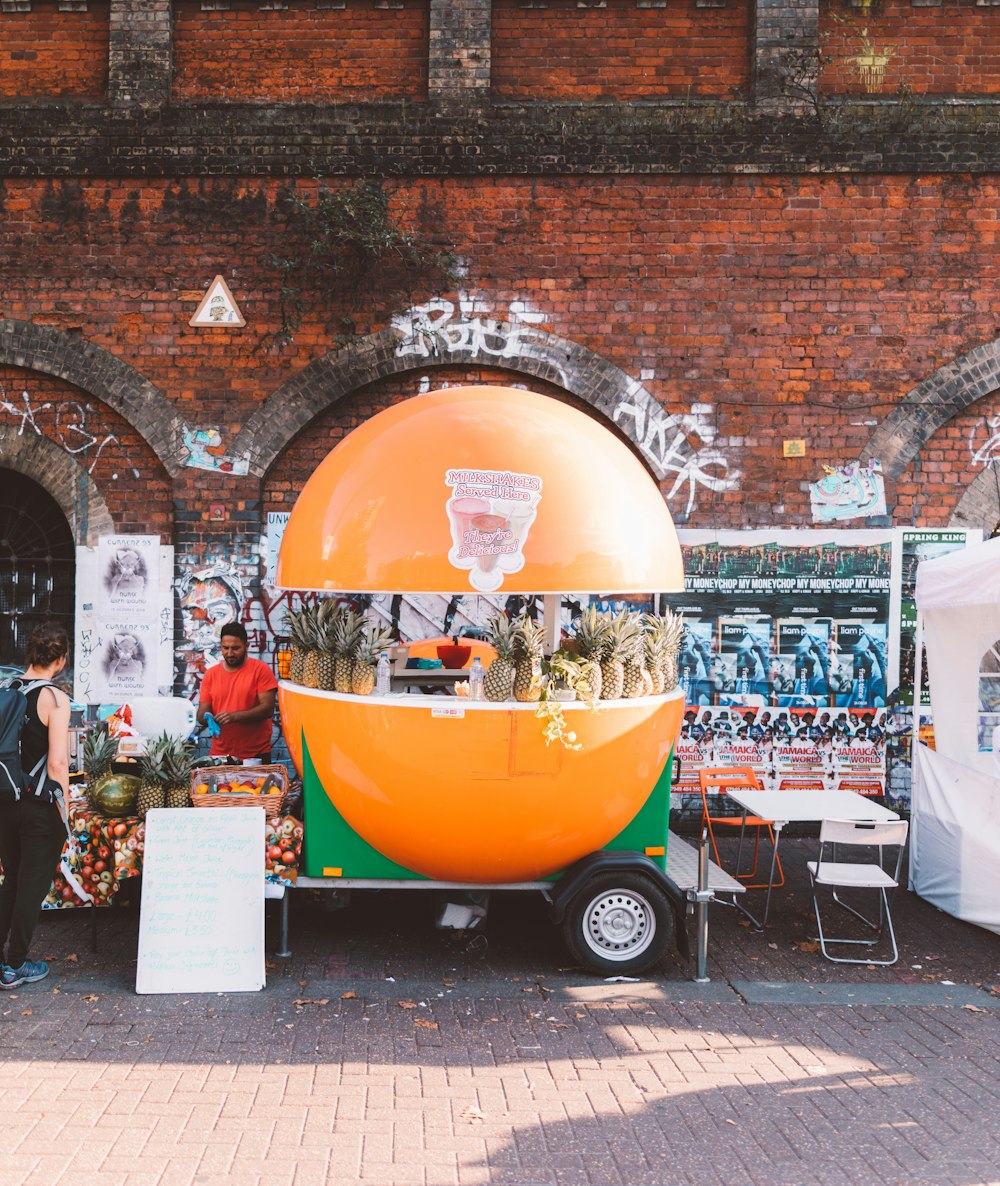 orange and green food stall