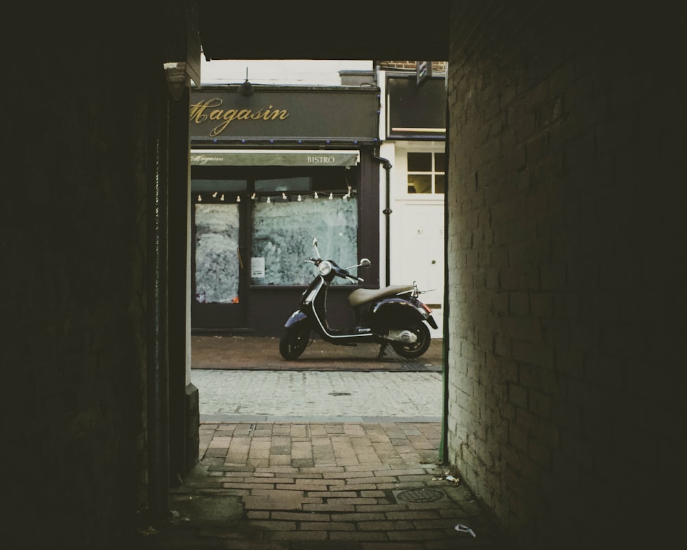 black automatic scooter as seen from alleyway