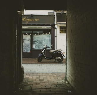 black automatic scooter as seen from alleyway