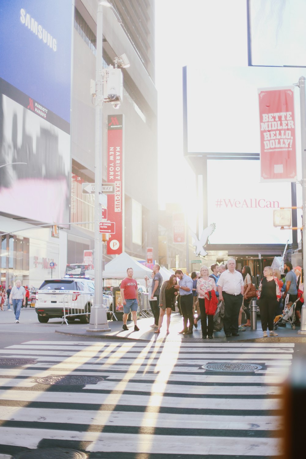 people standing in front of pedestrian lane