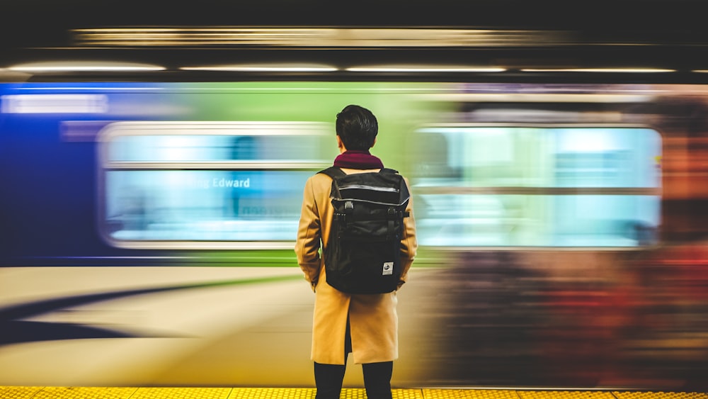 man wearing black backpack