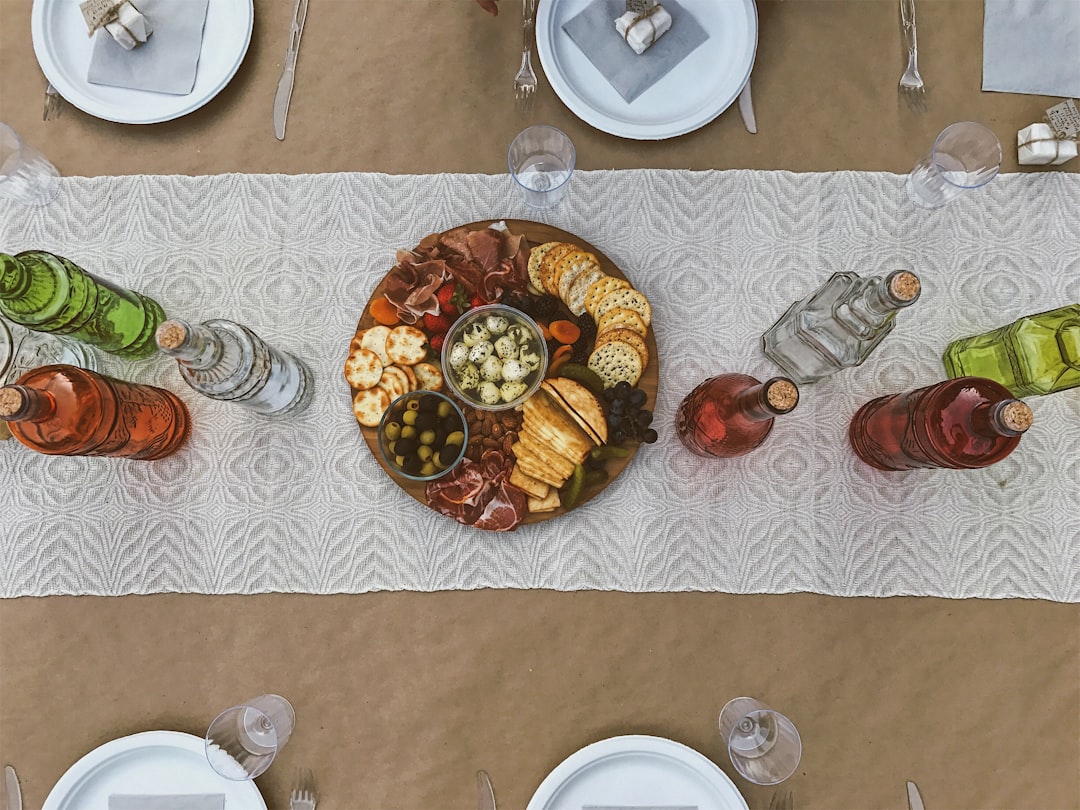 cooked food and wine bottles, This is a look for any party. The decorations are simple because we wanted the food to rad