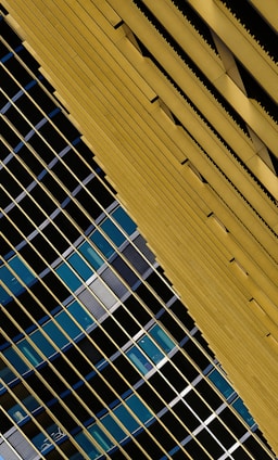 Abstract architectural lines in deep navy and gold symbolizing strength and trust.