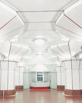 A sleek black and white futuristic restaurant interior with metallic gray accents and soft glowing lights.