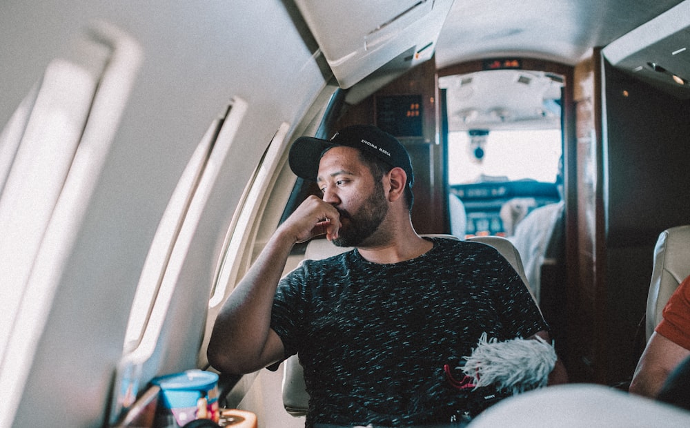 man sitting inside airplane