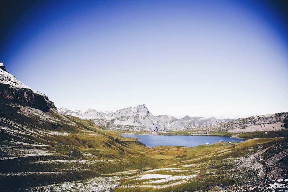 mountains near body of water during daytime