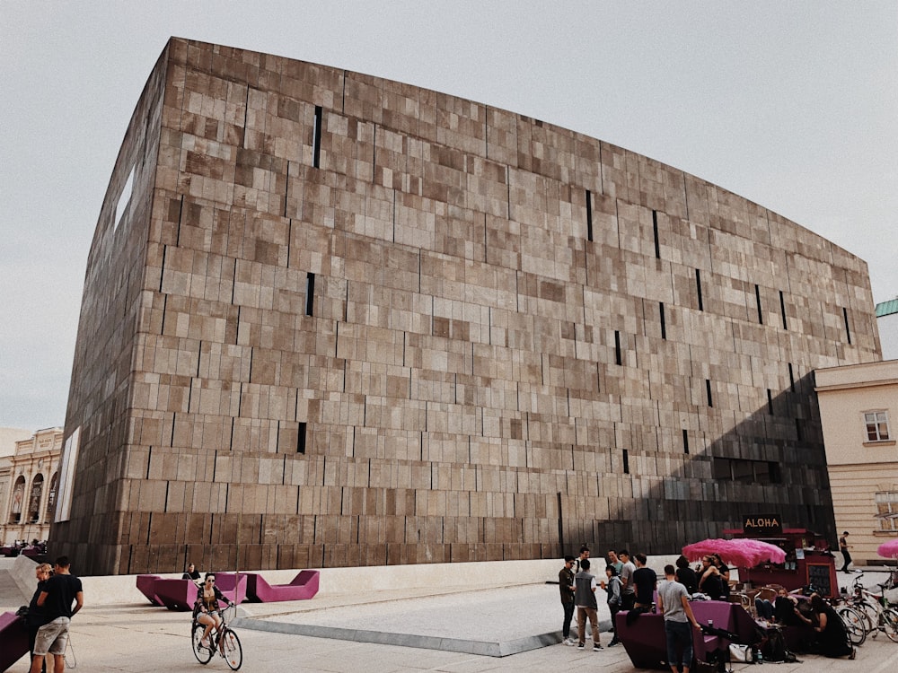 people walking and biking near building