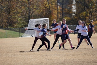 Teams competing in an exciting match of ultimate frisbee with dynamic throws.