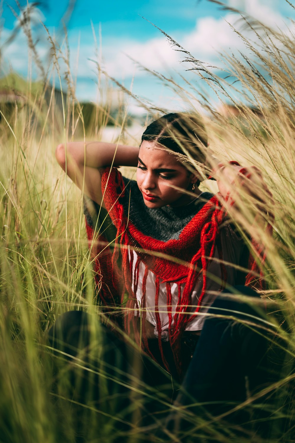 woman in black and red dress on brown plants during daytime