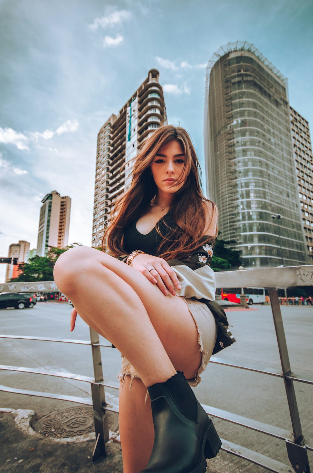 woman leaning on fence