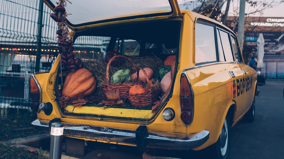 yellow vehicle with vegetables on compartment