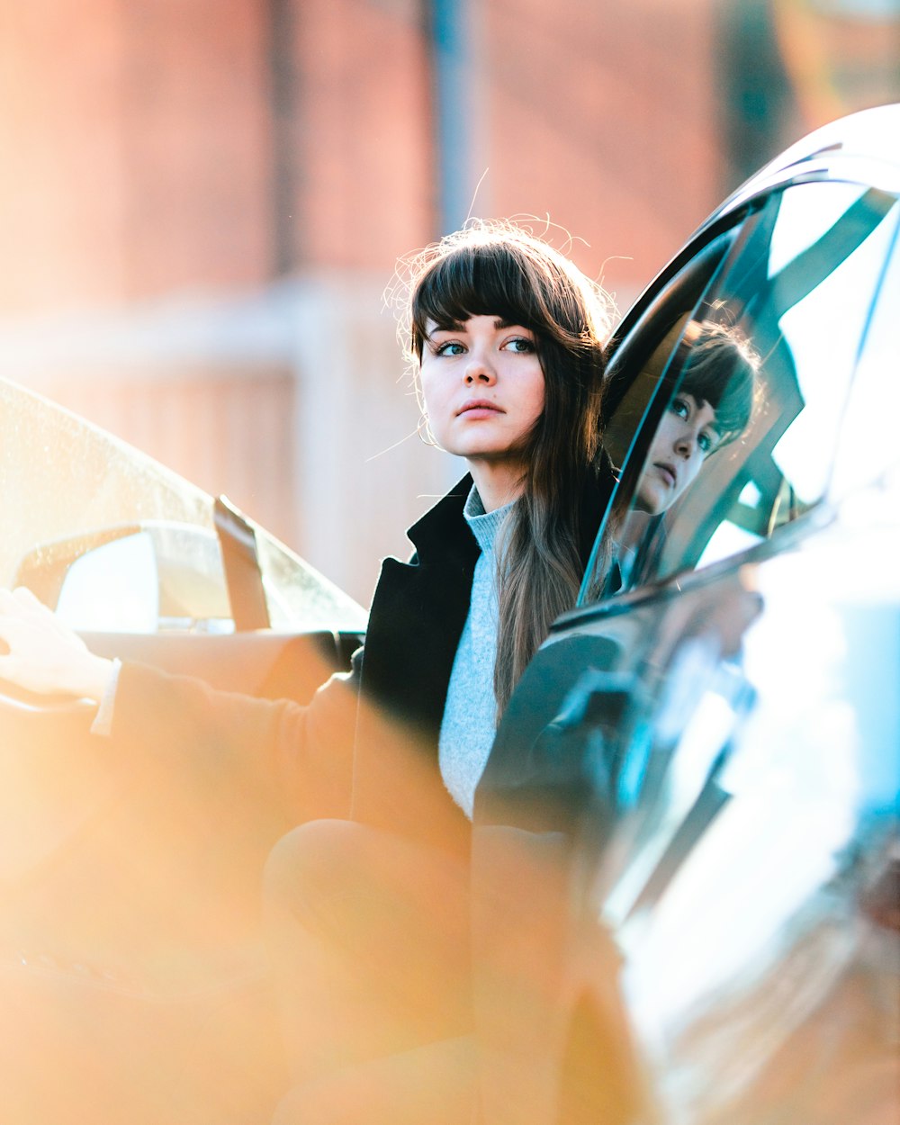 woman sitting inside vehicle