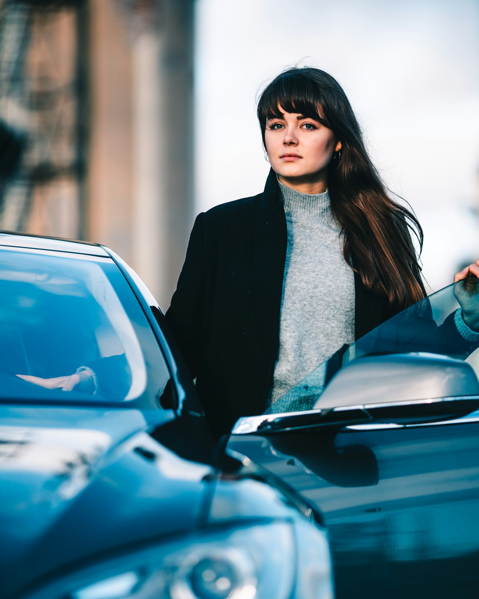 Canon EOS R sample photo. Woman standing beside vehicle photography