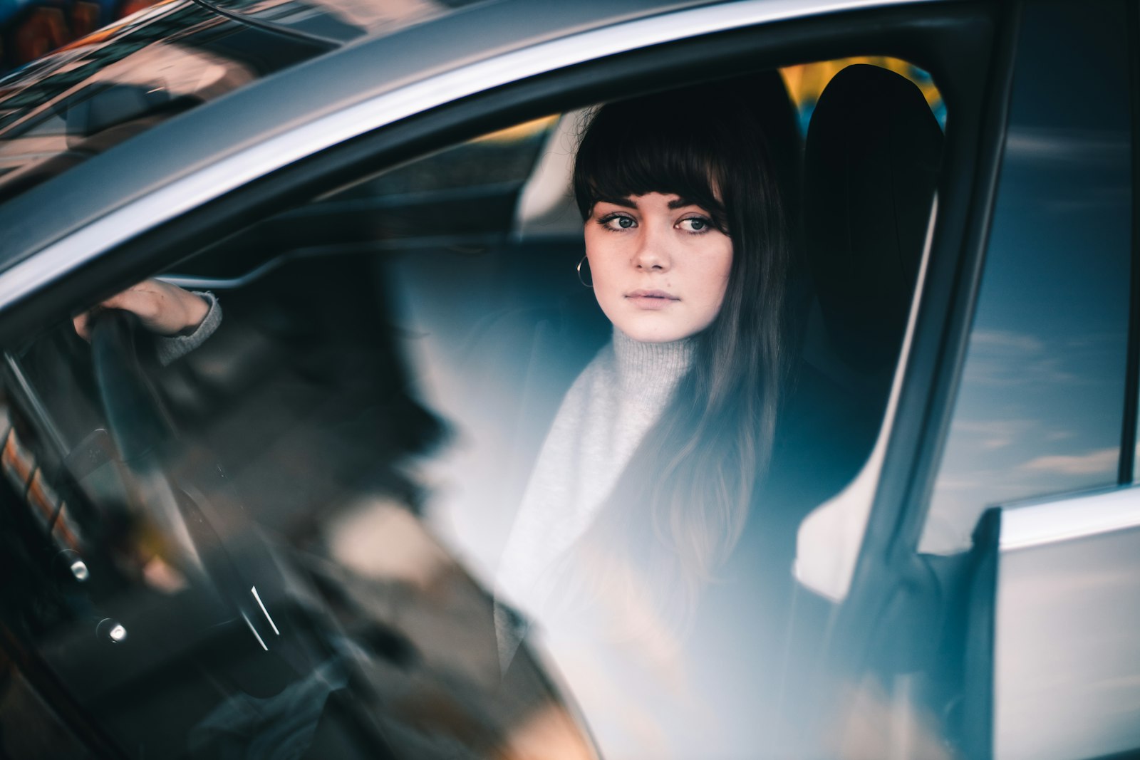 Canon EOS R sample photo. Woman sitting inside vehicle photography