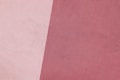 a close up of a pink and white background