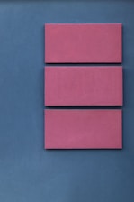 pink boards on blue surface