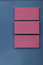 pink boards on blue surface