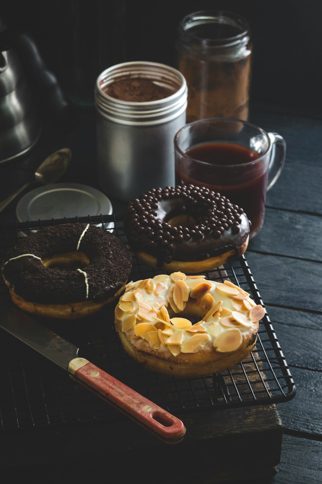 doughnut beside clear glass mug