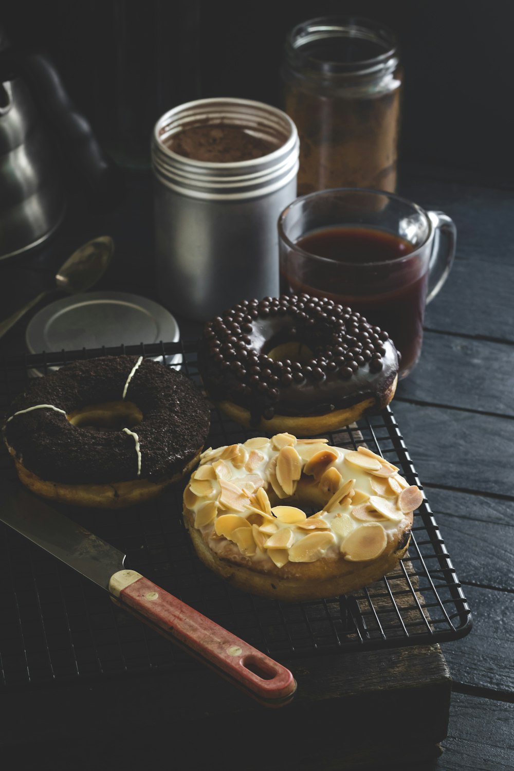 doughnut beside clear glass mug