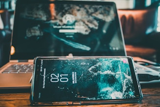 Technician syncing data on a laptop after returning to connectivity