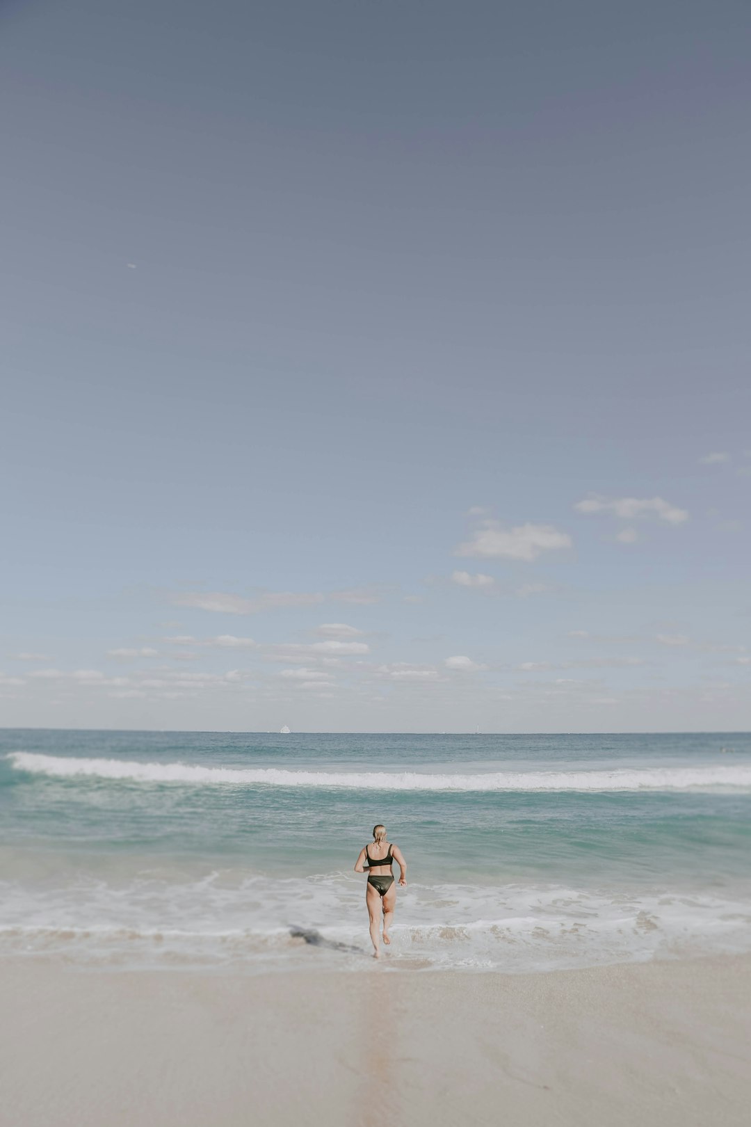 woman on seashore during daytime