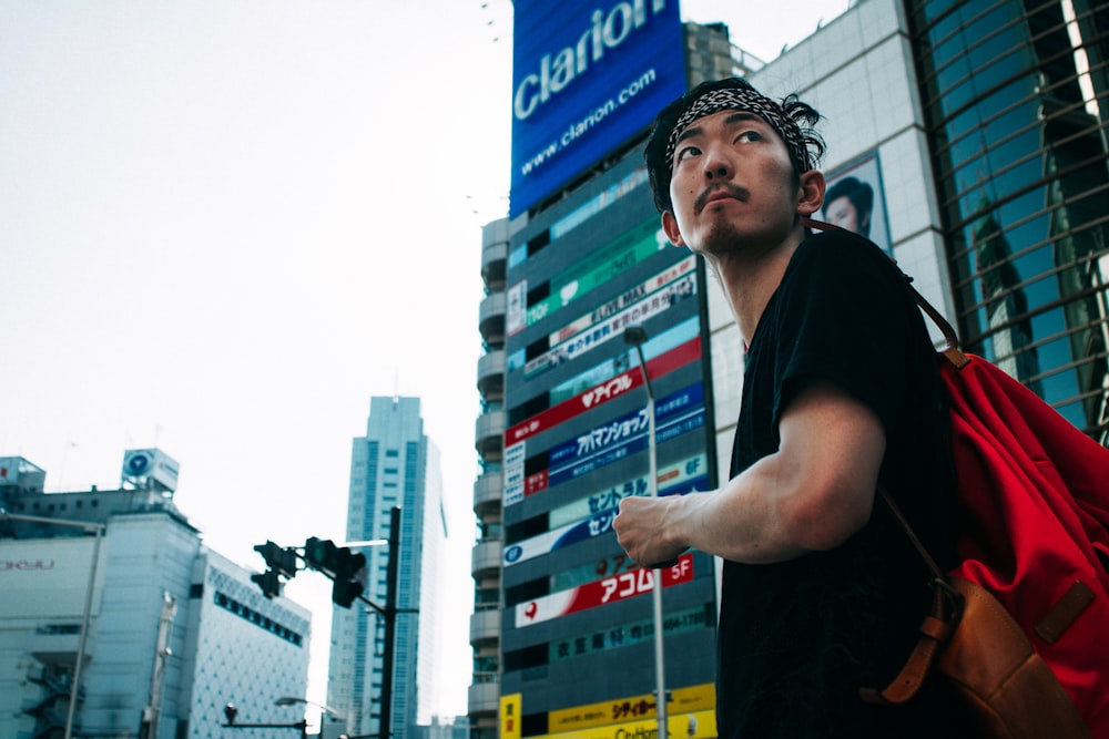 man standing near buildings