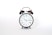 round black and white analog alarm clock