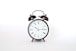 round black and white analog alarm clock