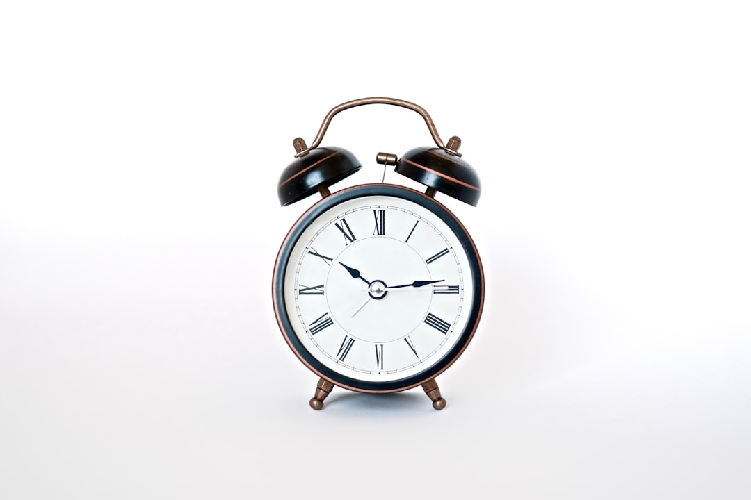 round black and white analog alarm clock, alarm clock