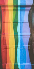 A close-up of a freshly painted wooden door with rich, vibrant colors and smooth finish.