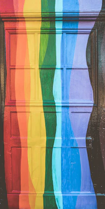 A close-up of a freshly painted wooden door with rich, vibrant colors and smooth finish.