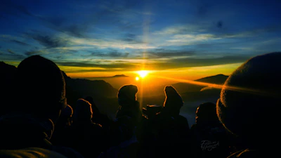 A sunrise over a mountain peak symbolizing new beginnings and hope.