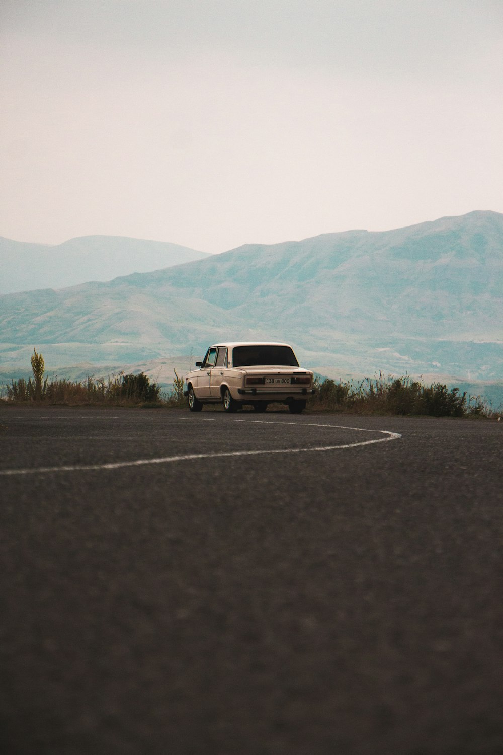 sedan on asphalt road