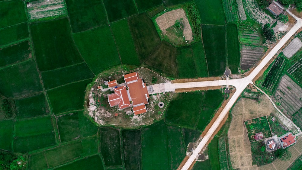 bird's eye photography of house on green field