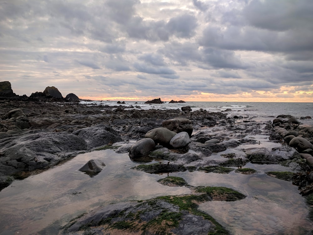 rock formations on body of water