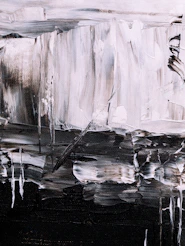 Abstract brushstrokes of black, white, and grey paint on a textured canvas