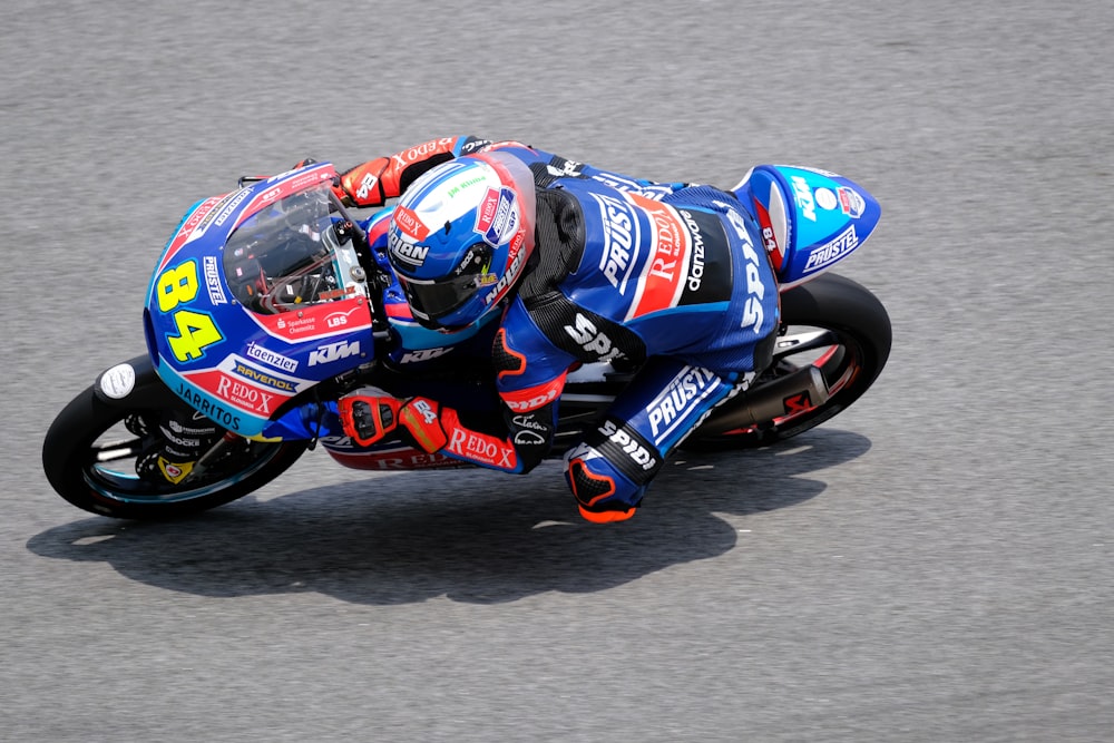 man riding sports bike during daytime