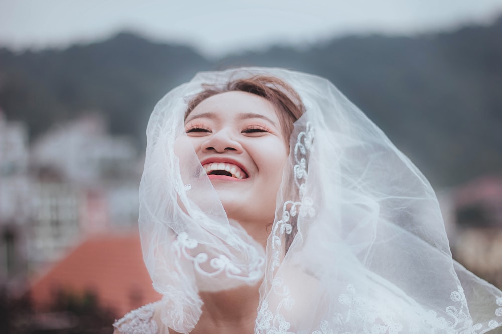 woman wearing white lace wedding veil