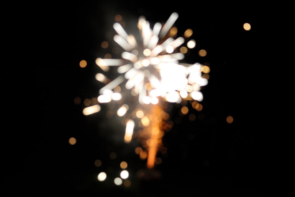 a fireworks is lit up in the night sky