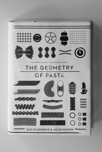 The Geometry of Pasta book on white surface