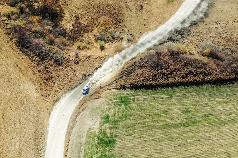 blue vehicle on road